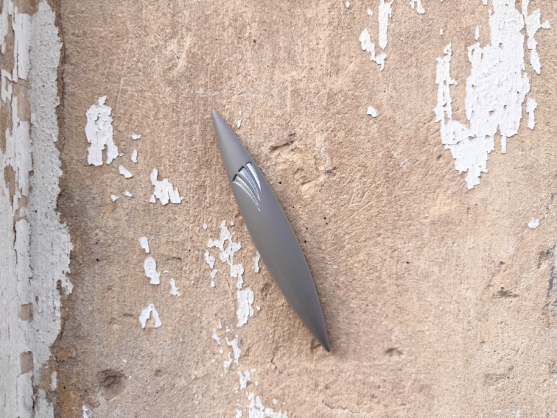 Large Grey Apollo Stone Mezuzah mounted on textured wall