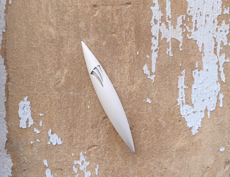 Large White Apollo Stone Mezuzah mounted on textured wall