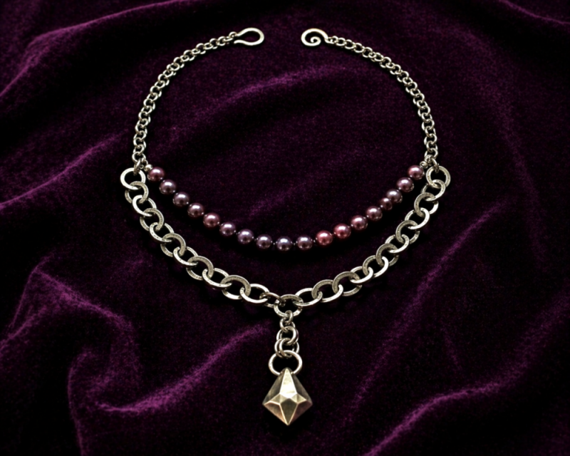 Urban Pearl Necklace styled on rustic wood surface with oxidized silver chain, dark peacock pearls and faceted geometric pendant by Laura Cowan Modern Judaica
