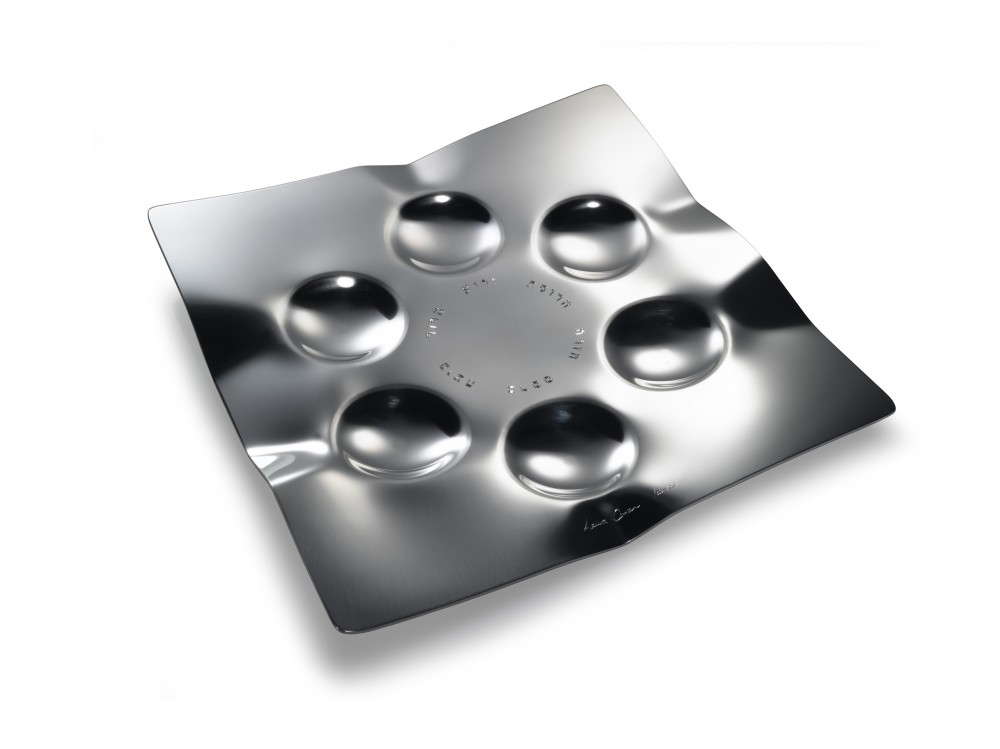 Moon Seder Plate in polished aluminum with crater-shaped indentations