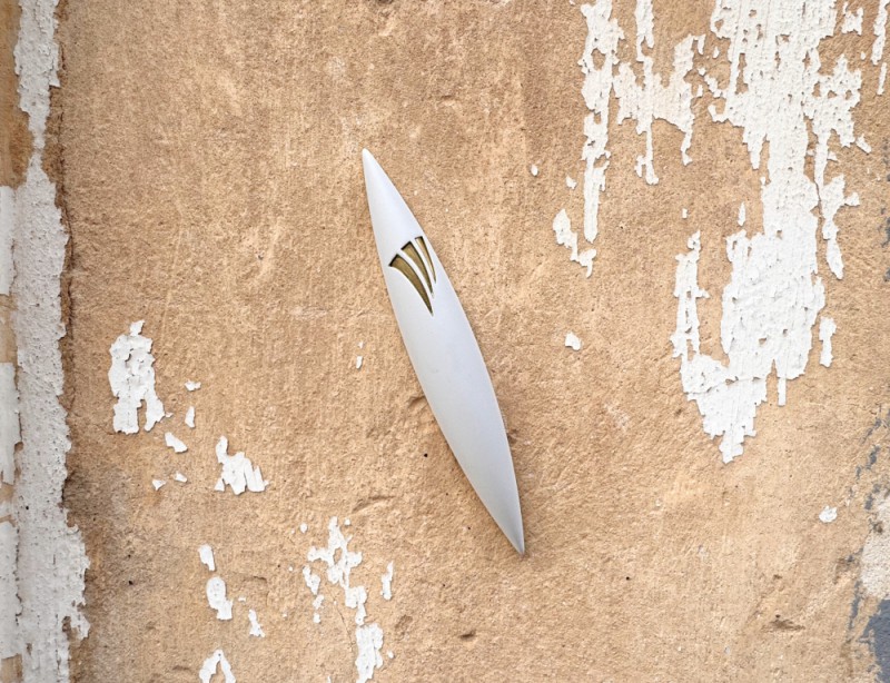 Large White Apollo Stone Mezuzah mounted on textured wall