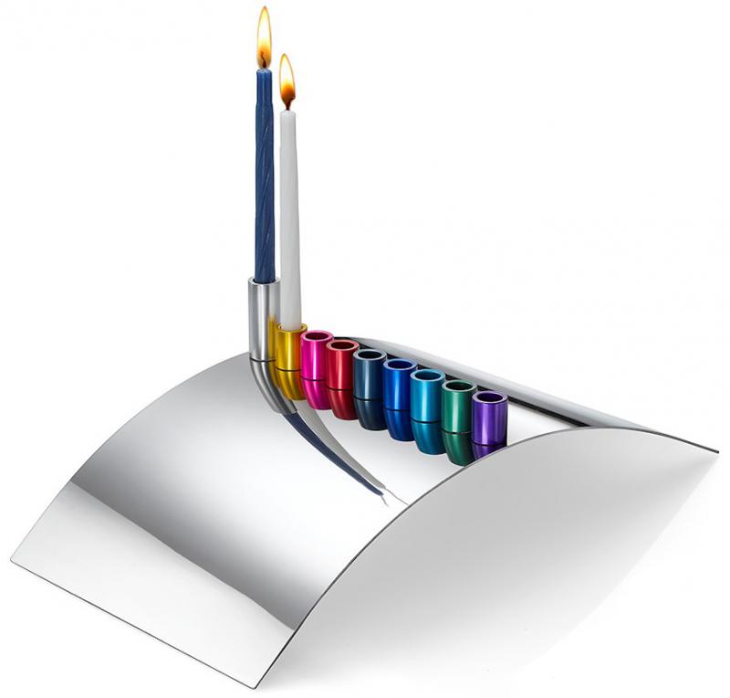 Building Bridges Menorah designed by Laura Cowan is made of highly polished steel with colorful anodized aluminium magnetic candle holders
